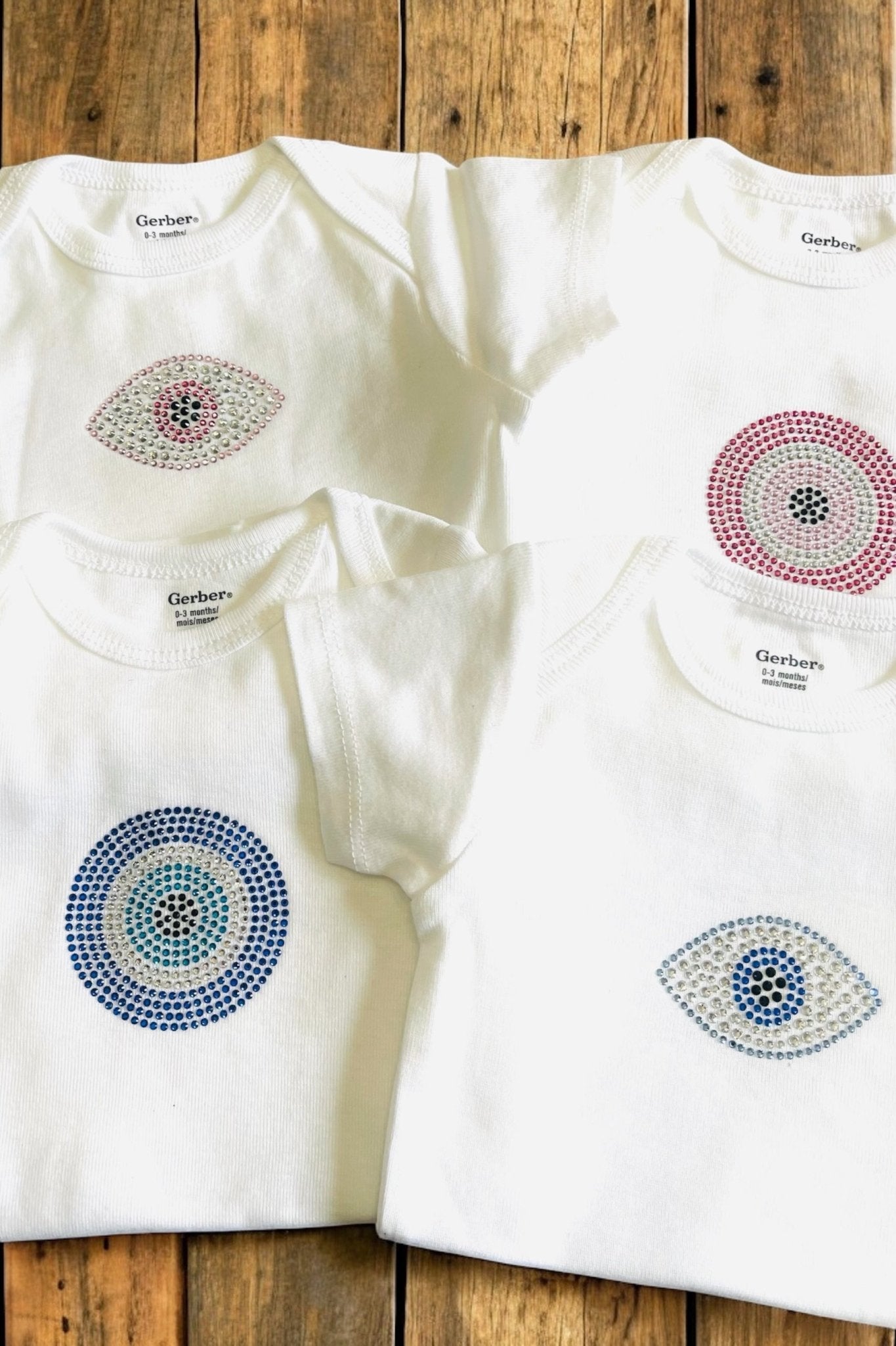 Evil eye baby onesies