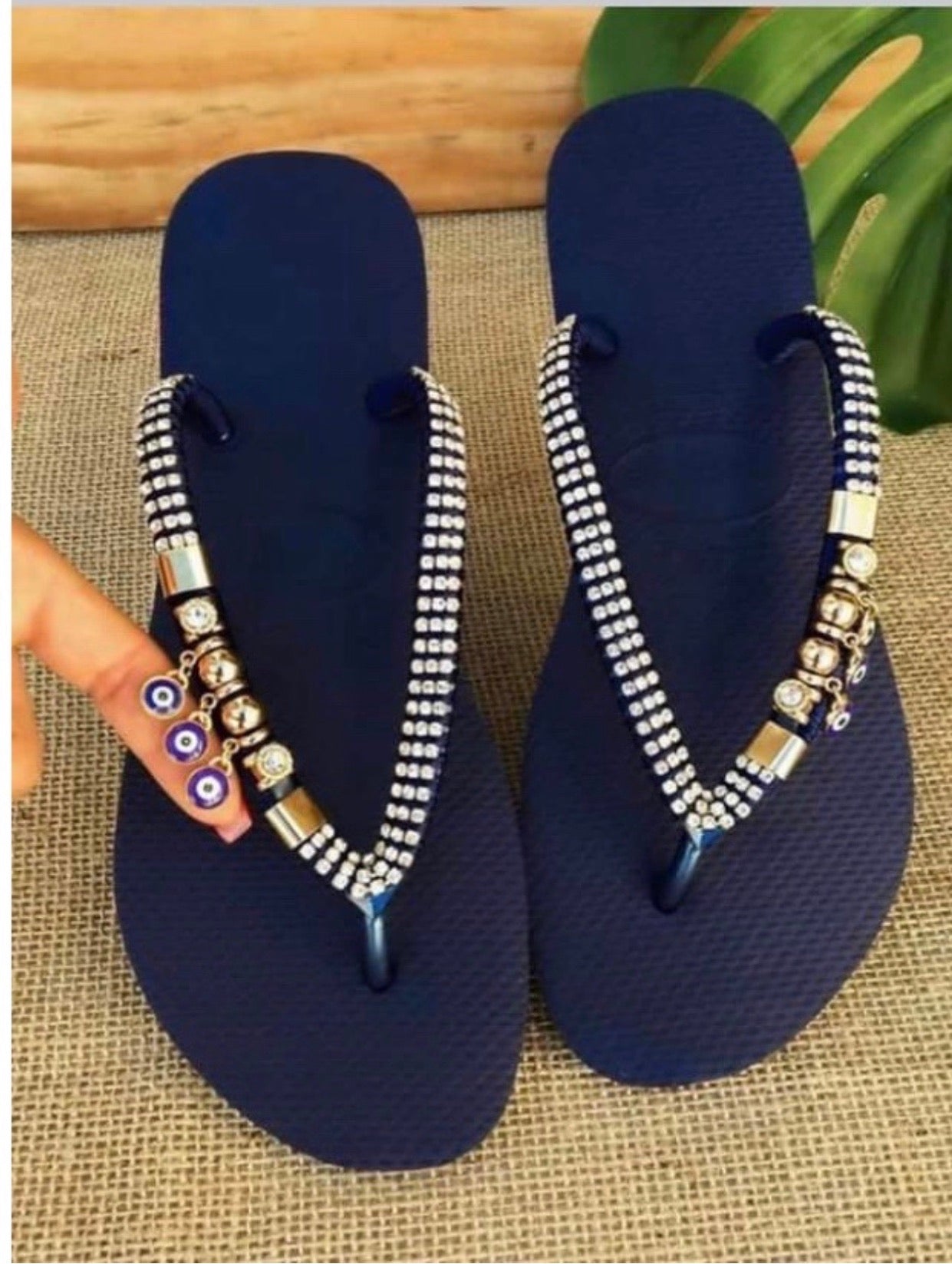 Flip flops with hanging evil eye Charm