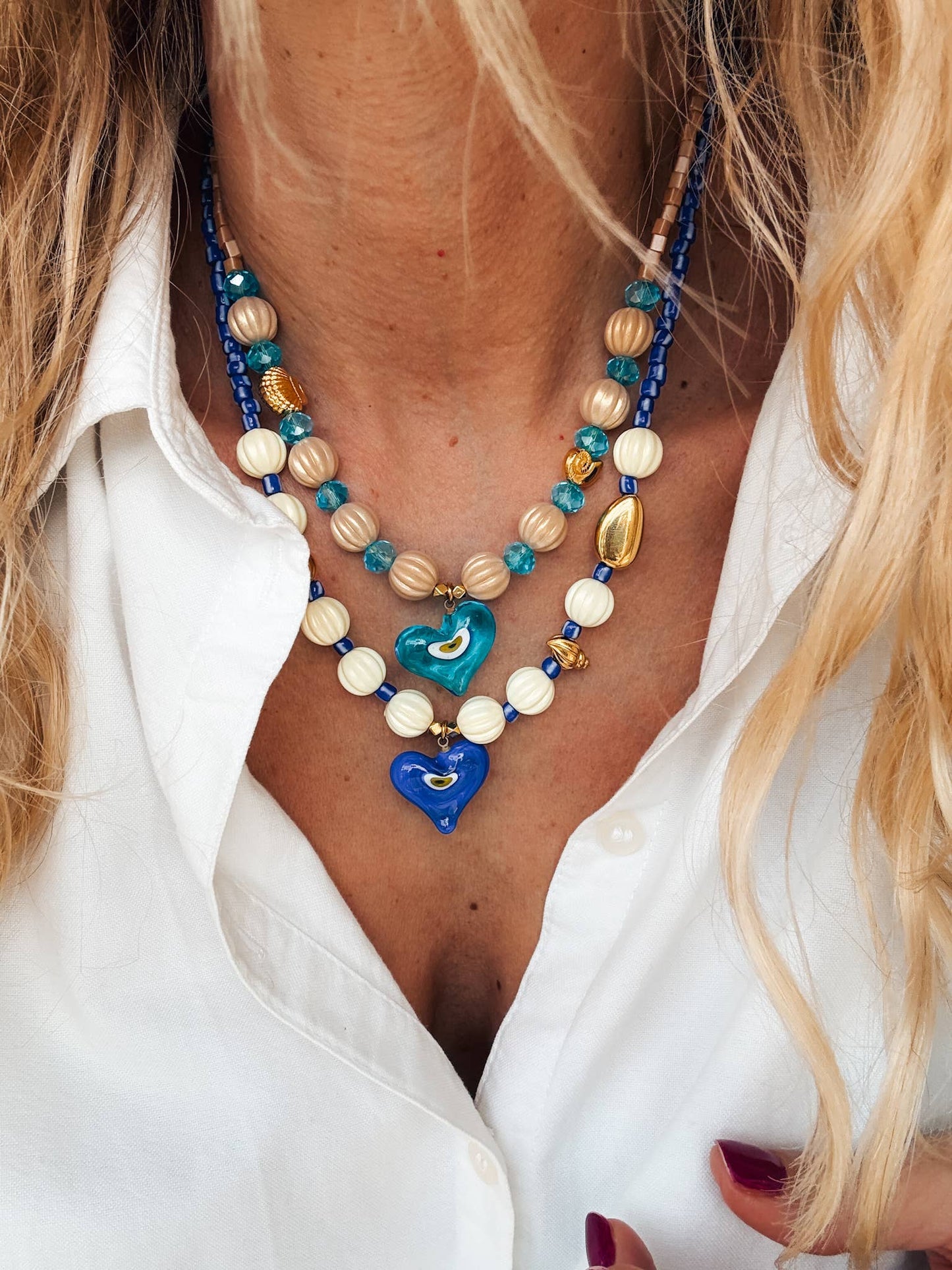 Necklaces with colored beads and glass eye heart