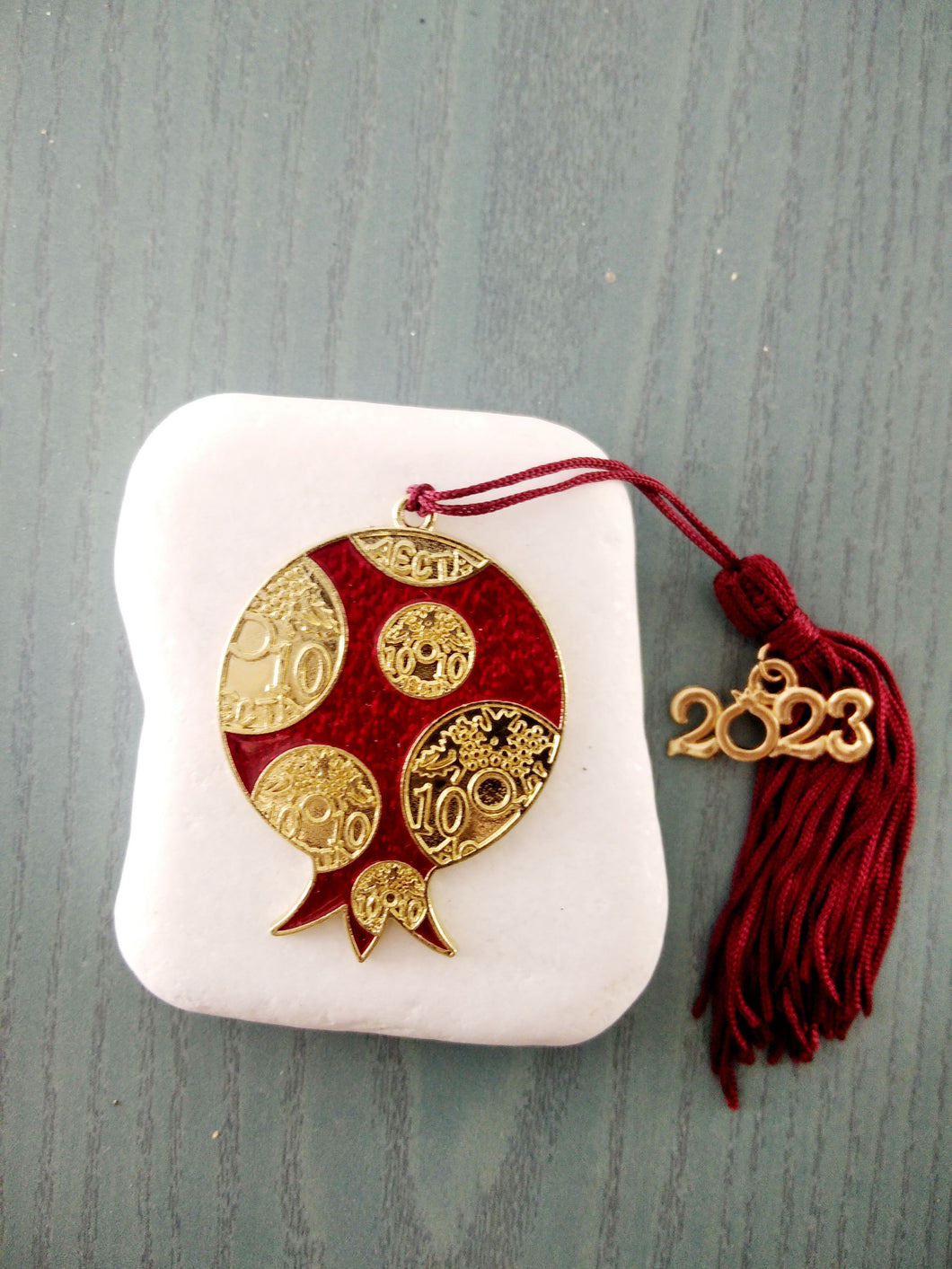 Marble stone with pomegranate charms