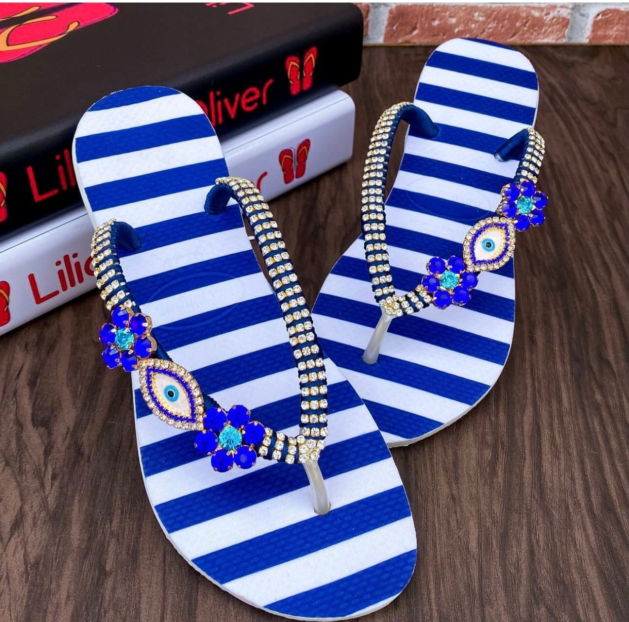 Evil eye striped flip flops